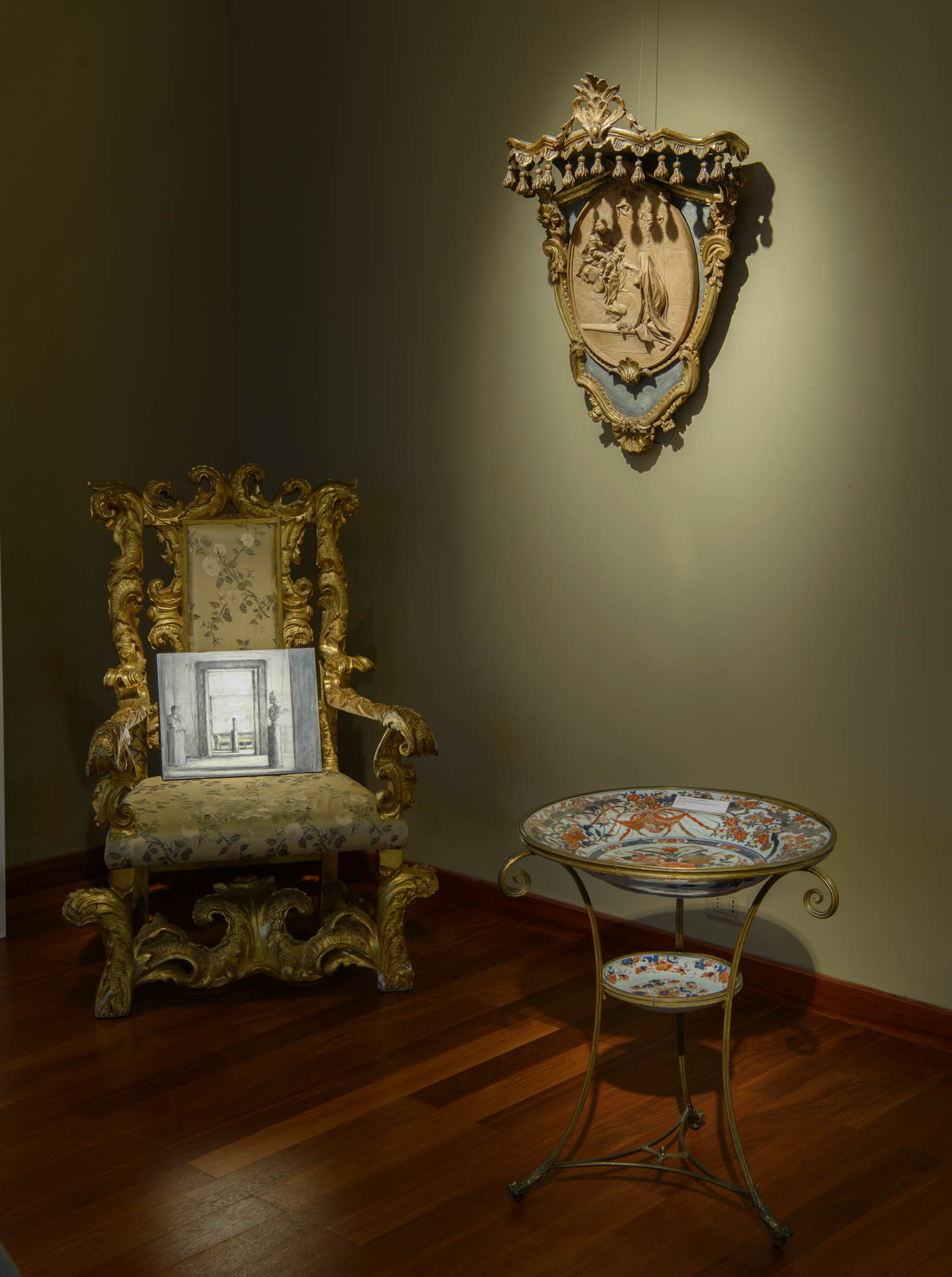 Artwork displayed on ornate chair