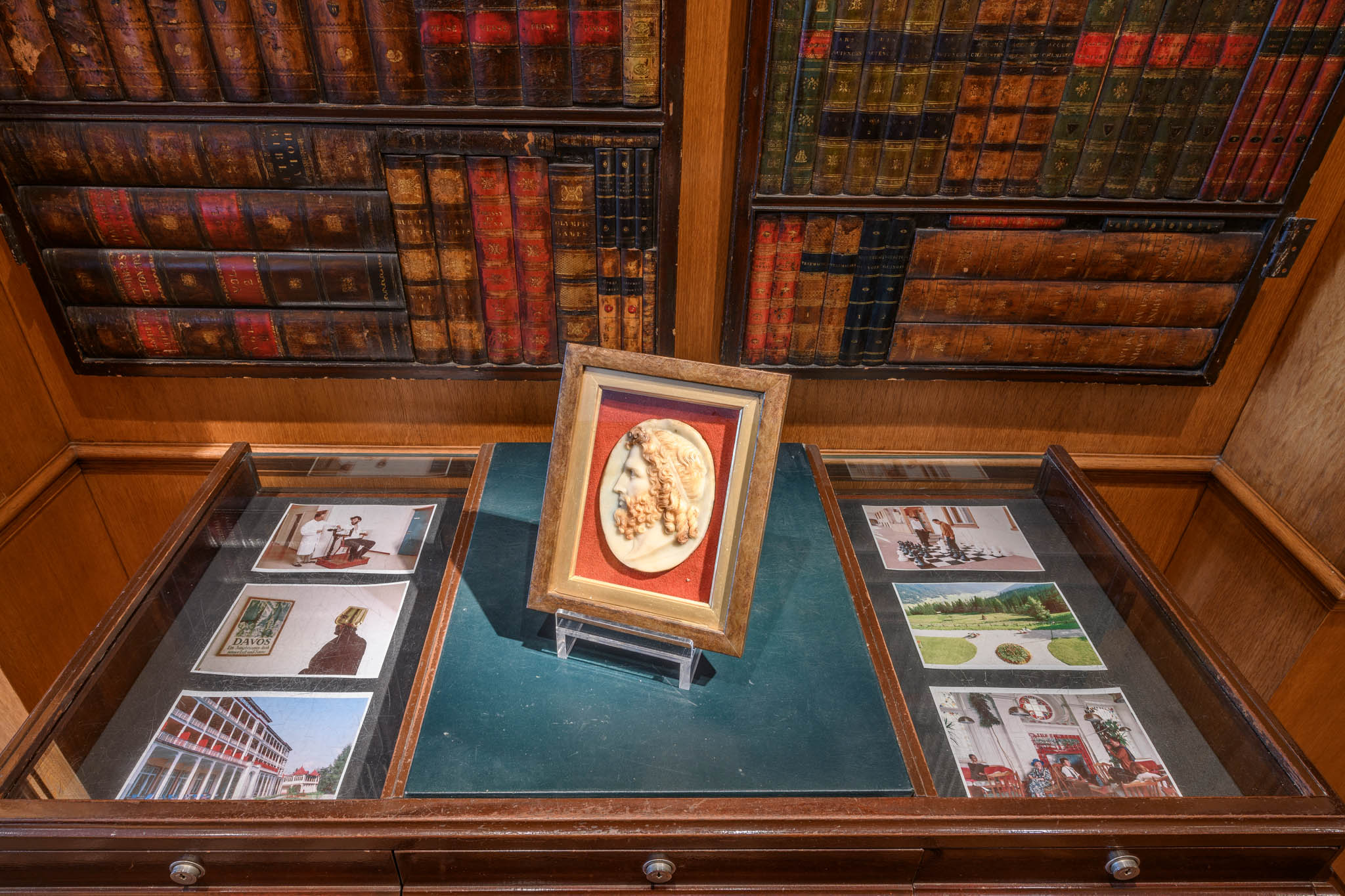 Display case with photographs and cameo
