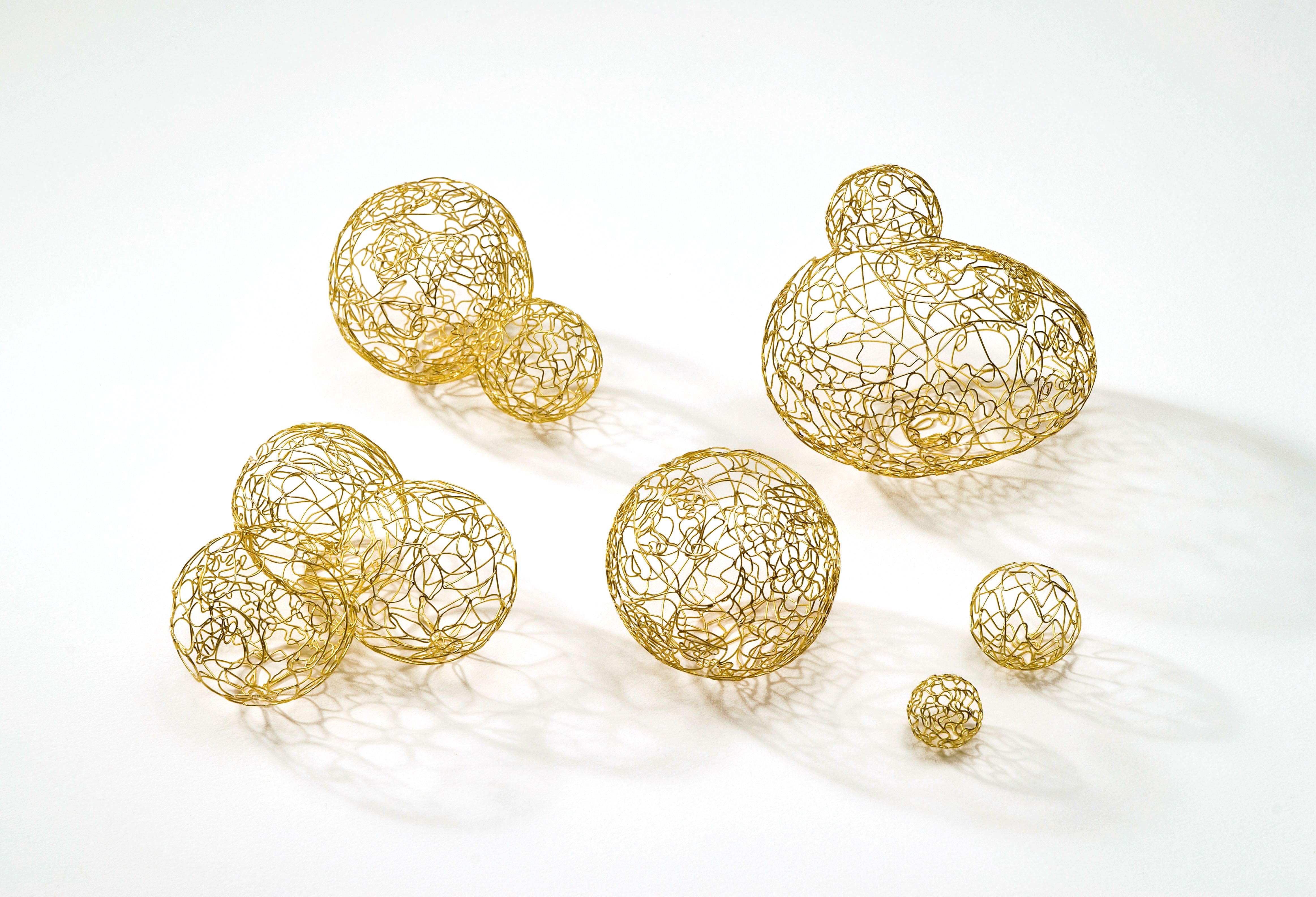 Gold earrings by Vered Kaminski